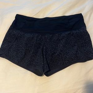 Lululemon shorts size 8. Black and grey floral print.